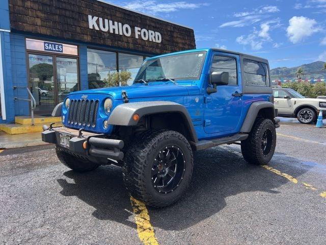 2015 Jeep Wrangler Sport in Hydro Blue Pearl Coat — front three-quarter view