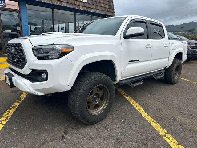 2023 Toyota Tacoma TRD Sport V6 in White — front three-quarter view